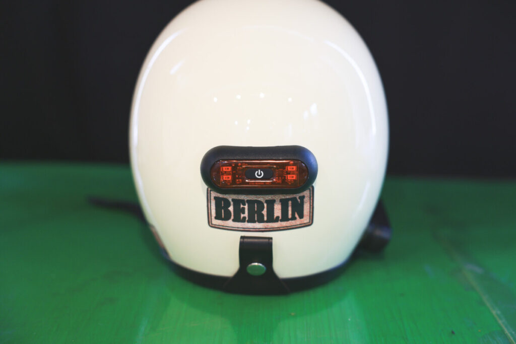 Back view of the ivory motorcycle helmet