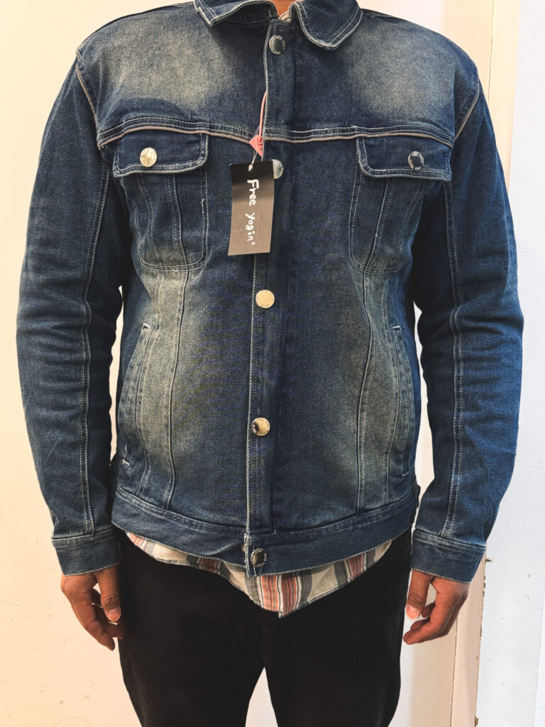 "Front view of a man wearing a heavyweight cotton-polyester blend denim jacket in vintage wash style"