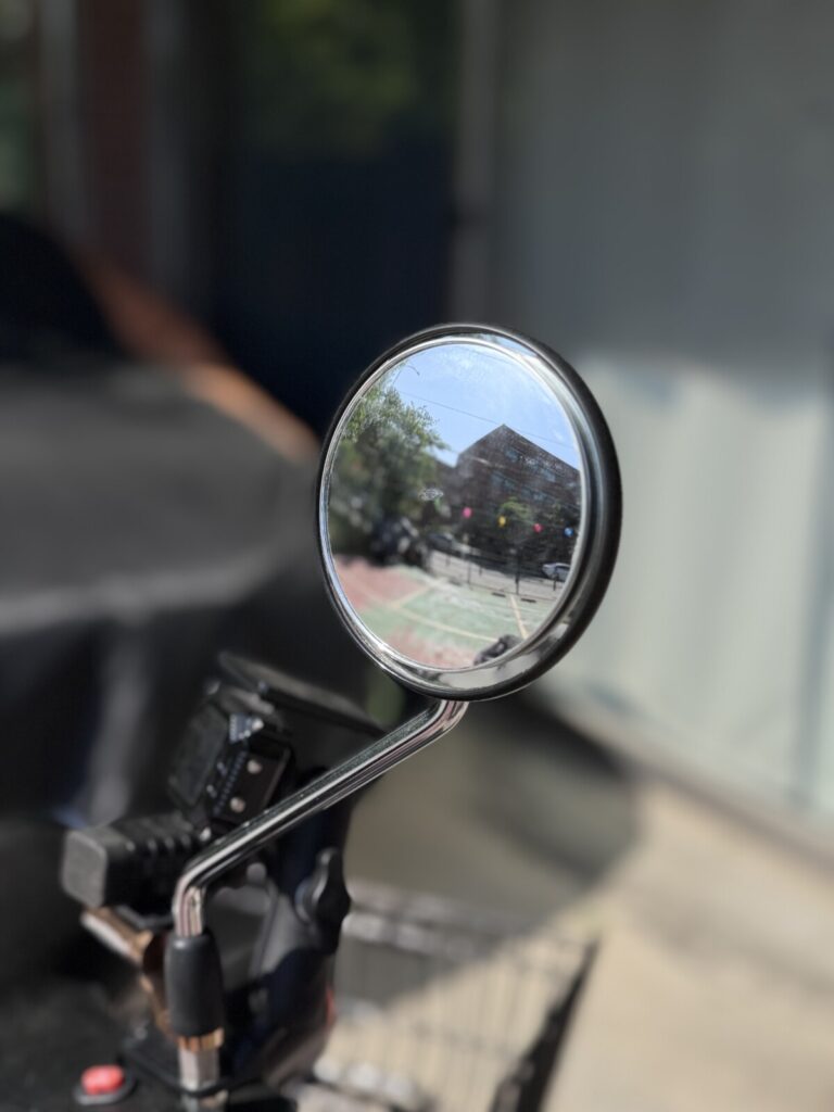 3R Blind Spot Mirror close-up on Honda Super Cub round stock mirror — clean flush fit
