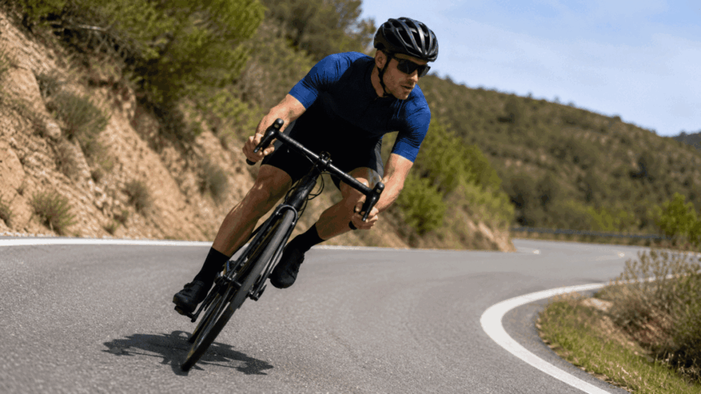 cyclist leaning into a turn — natural counter steering