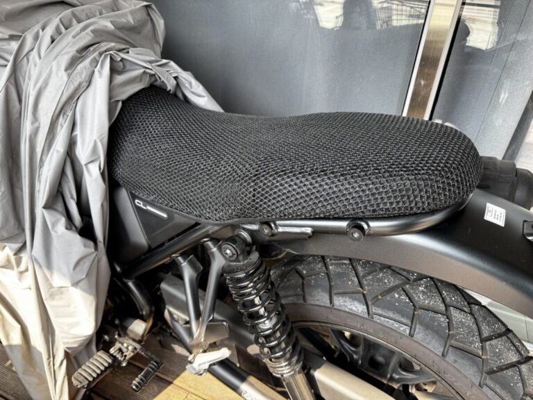 Honda CL500 seat cover installed — 3D honeycomb mesh cover on the bike